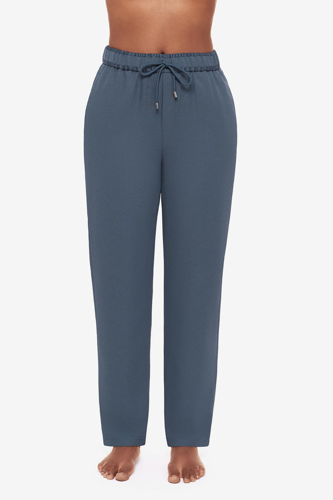 Close up of woman in blue jogger pants