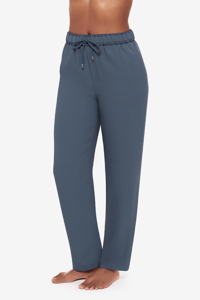 Close up of woman in blue jogger pants to the left