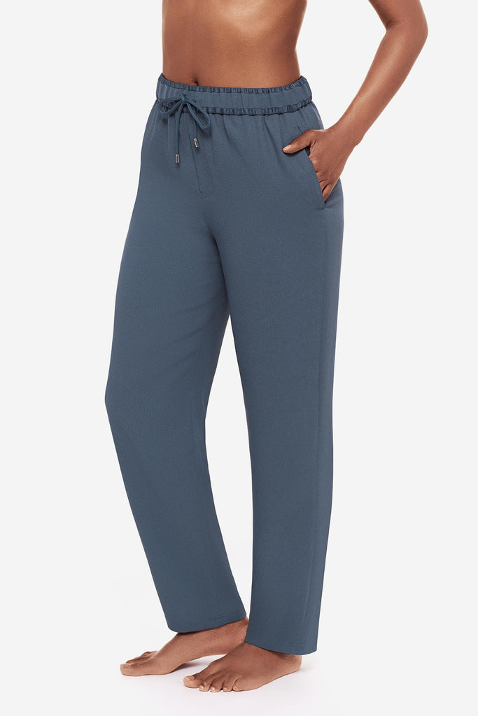 Close up of woman in blue jogger pants to the left