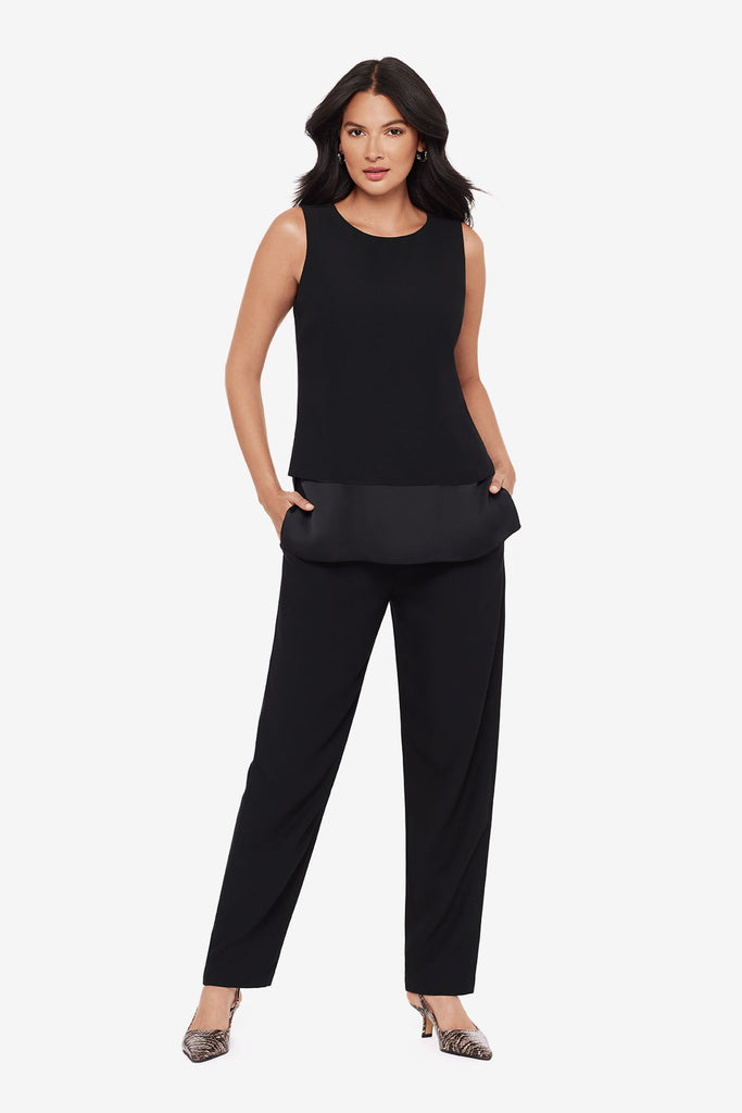 Woman wearing a black tunic blouse with matching jogger pants