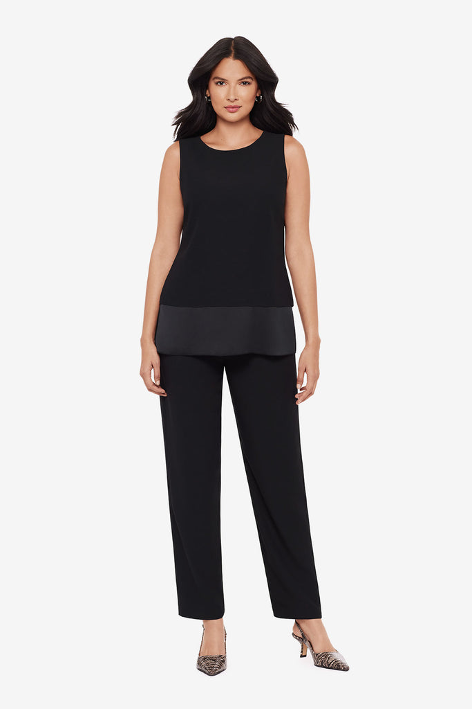 Woman wearing a black tunic blouse with matching jogger pants