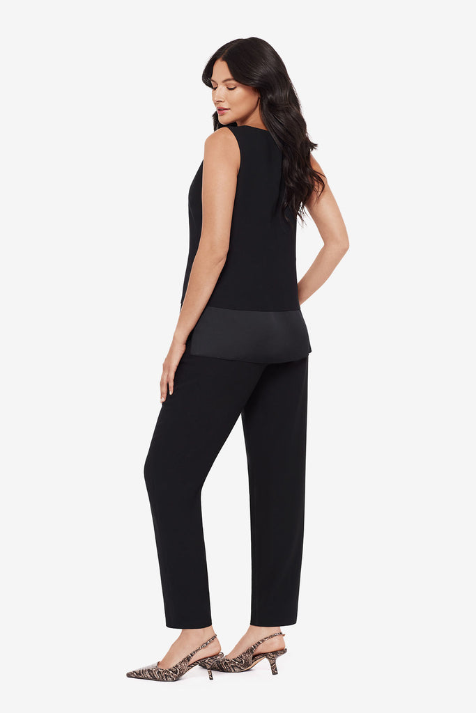 Woman turned left wearing a black tunic blouse with matching jogger pants