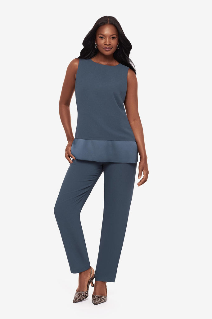 Woman wearing a blue layered tunic blouse with matching jogger pants