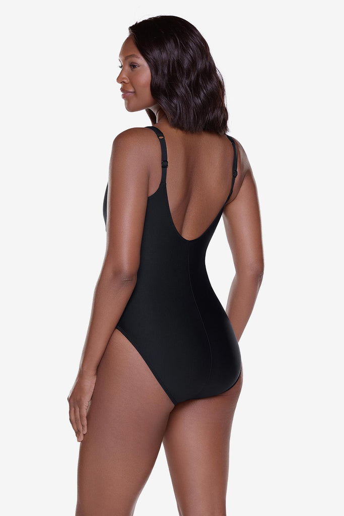Woman turned left wearing a black one-piece swimsuit