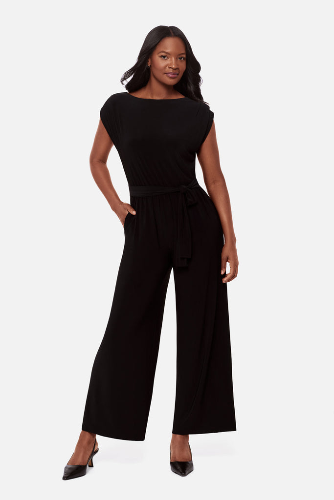 Woman wearing a black short sleeve romper