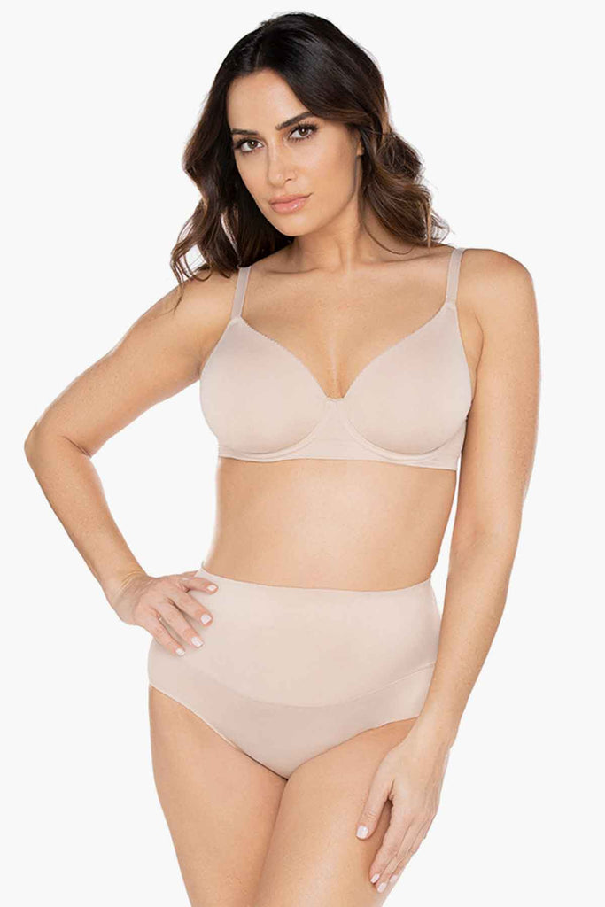 Woman in a miracle suit shape wear.