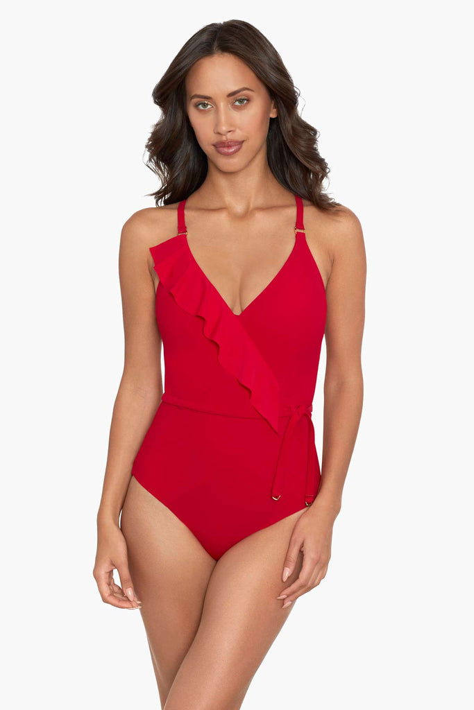 Woman wearing a one piece swim dress. 